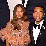 Chrissy Teigen and John Legend arrive at Vanity Fair Oscar Party