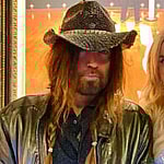 Firerose and Billy Ray Cyrus pose together backstage at the Grand Ole Opry