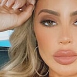 Larsa Pippen poses from a car