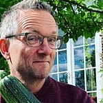 Dr. Michael Mosley holding vegetables