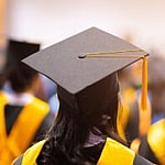Students wearing graduation caps and gowns