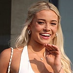 Olivia Dunne appears on a balcony at the home of Michael Rubin where he and Travis Scott are hosting the 4th July White party in Bridgehampton, New York. 04 Jul 2024 Pictured: Olivia Dunne,. Photo credit: MEGA TheMegaAgency.com +1 888 505 6342 (Mega Agency TagID: MEGA1162236_003.jpg) [Photo via Mega Agency]