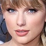 Taylor Swift poses an an event