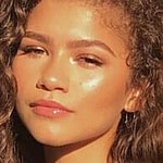 Zendaya poses looking glowing