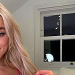 Elle Brooke smiles at the camera.