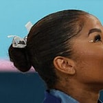 Jordan Chiles holding bronze medal at 2024 Olympics