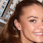 Nina Agdal and Logan Paul smile for the camera.