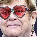 Elton John wearing heart-shaped glasses