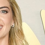 Kate Upton smiles at an event