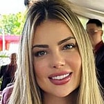 Denise Rocha smiles at the camera.