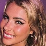 Andreea Dragoi smiles while taking a selfie.