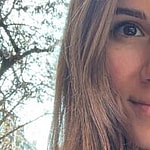 Alexandra Ianculescu smiles at the camera.