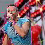 Vocalist Chris Martin along with his band Coldplay during a performance on a television show at Rockefeller Plaza in New York City