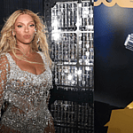 Beyonce next to a lightsaber