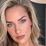 Paige Spiranac poses for the camera.