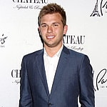 Chase Chrisley posing on the red carpet.