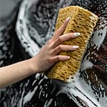 A person washing a car