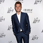 Chase Chrisley posing on the red carpet.