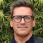 Photo collage of Jon Hamm and Garcelle Beauvais.