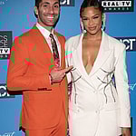 Nev Schulman and Kamie Crawford posing on the red carpet.