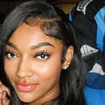 Angel Reese posing for a picture.