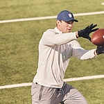 Brock Bowers catching football for Greatness Wins campaign