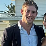 A photo of Billy Haire and Naomie Olindo smiling