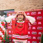 Bailey Zimmerman at Raising Cane's event for bike giveaway