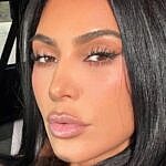 Kim Kardashian takes a selfie in the car