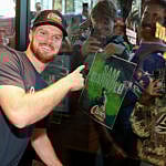 Sam Darnold with fans in Seattle