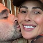 Alan Bersten kisses Emma Slater on the cheek