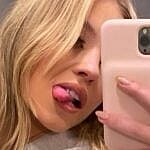 Sydney Sweeney taking mirror selfie