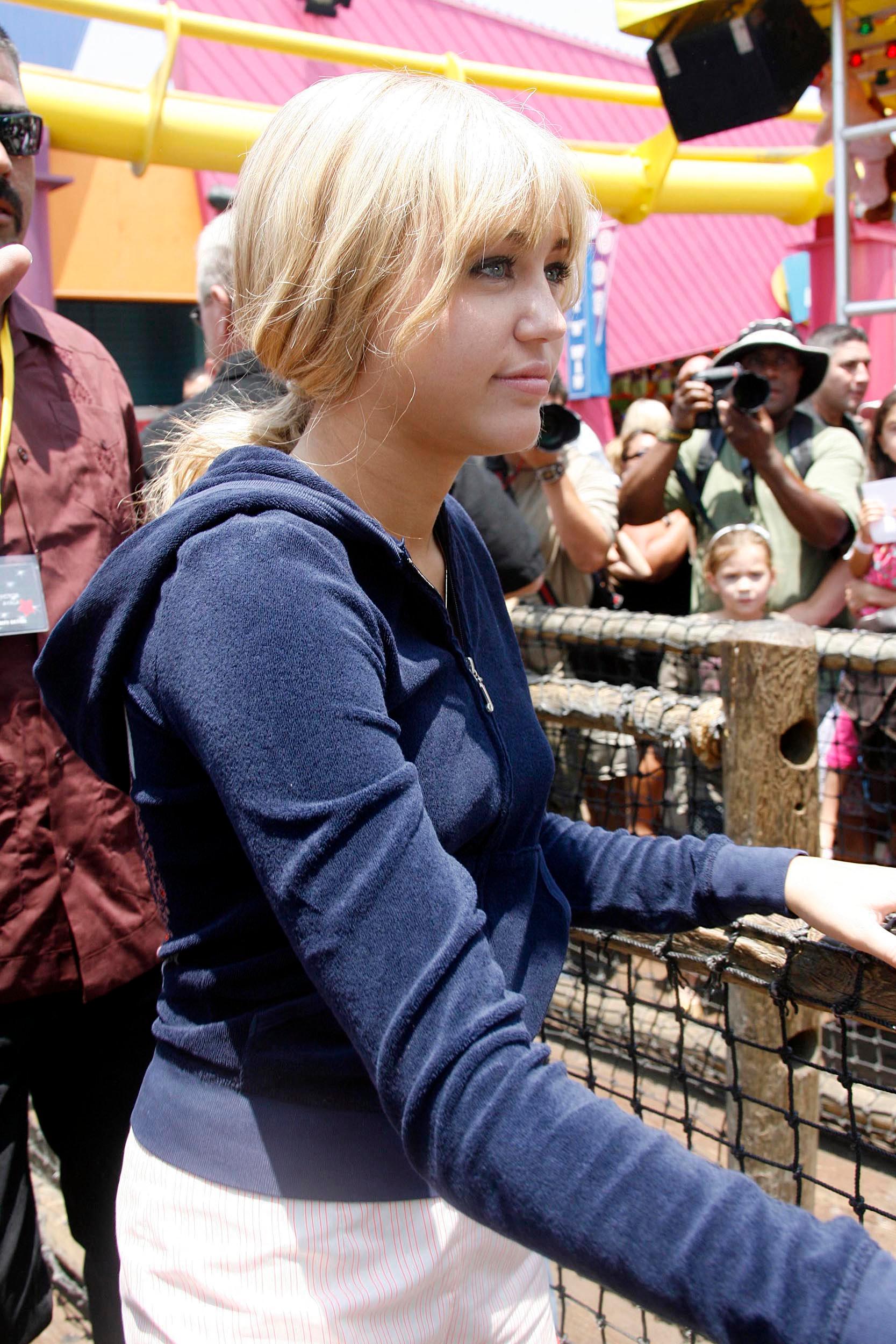 Miley Cyrus as Hannah Montana