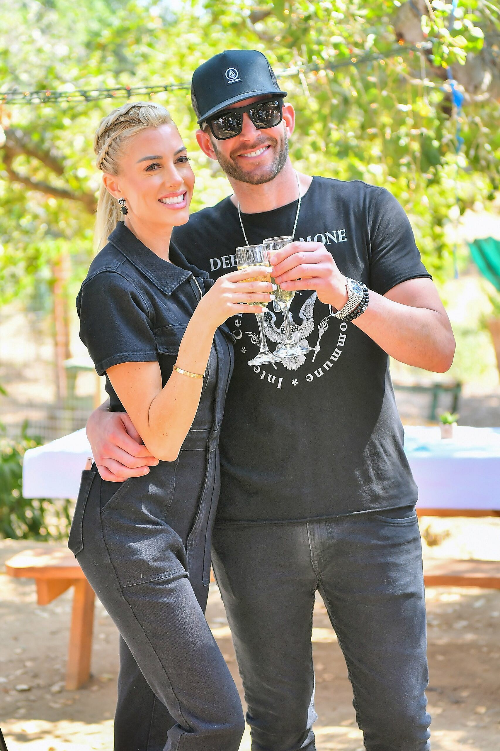 Heather Rae Young and Tarek El Moussa stroll through the Kindred Spirits Care Farm after celebrating her new Peta Campaign