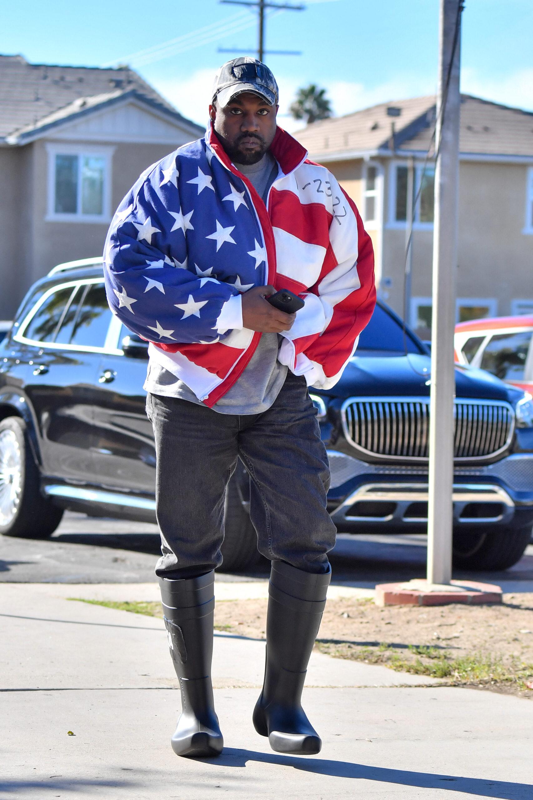 Kanye West heads to a meeting after heading to church wearing an American flag jacket