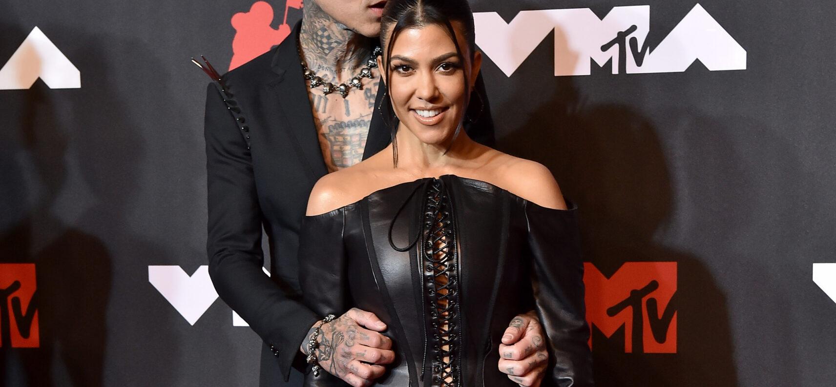 Kourtney Kardashian & Travis Barker posing