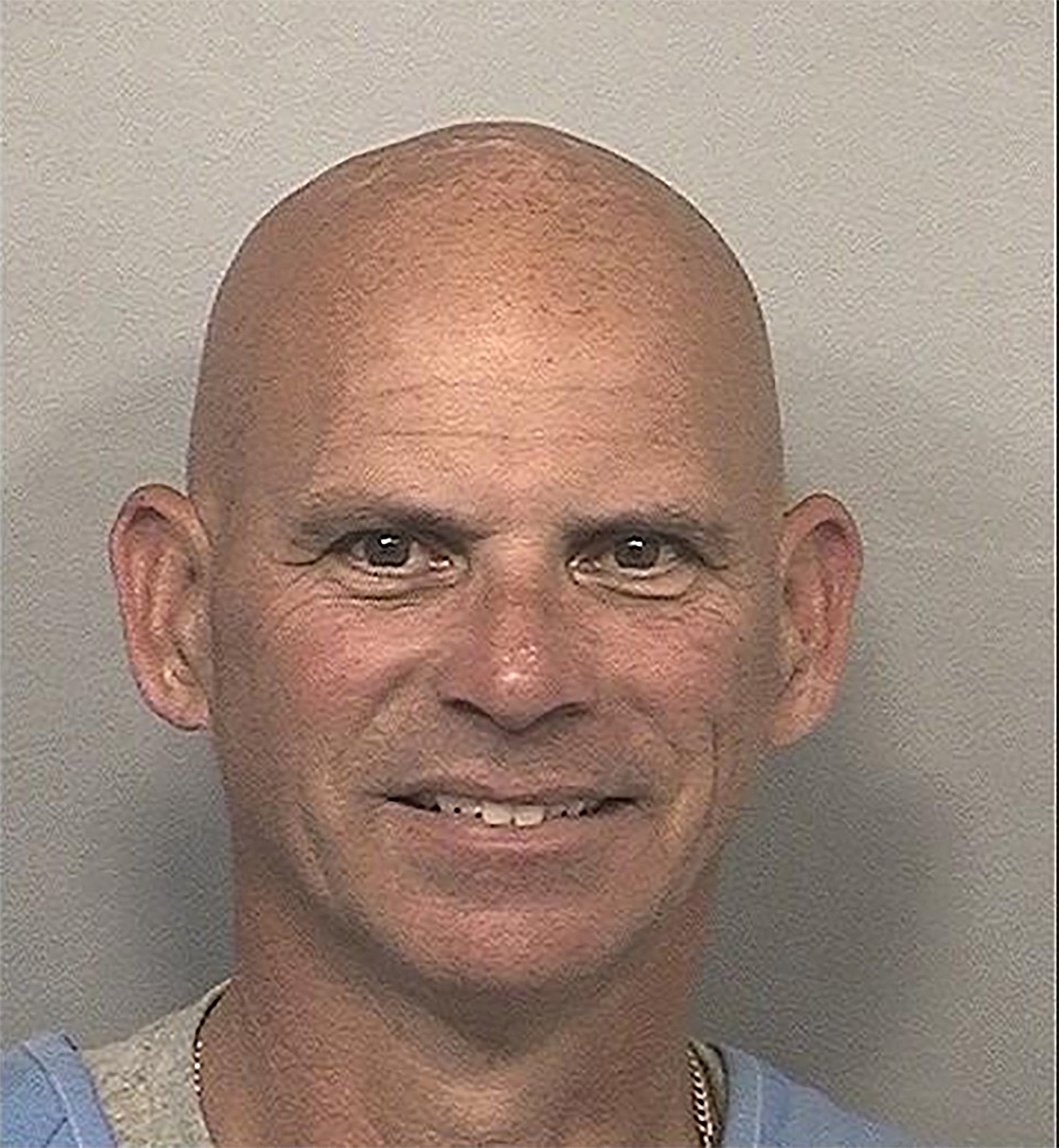 Lyle Menendez grins widely on their most recent mugshots from jail in California.