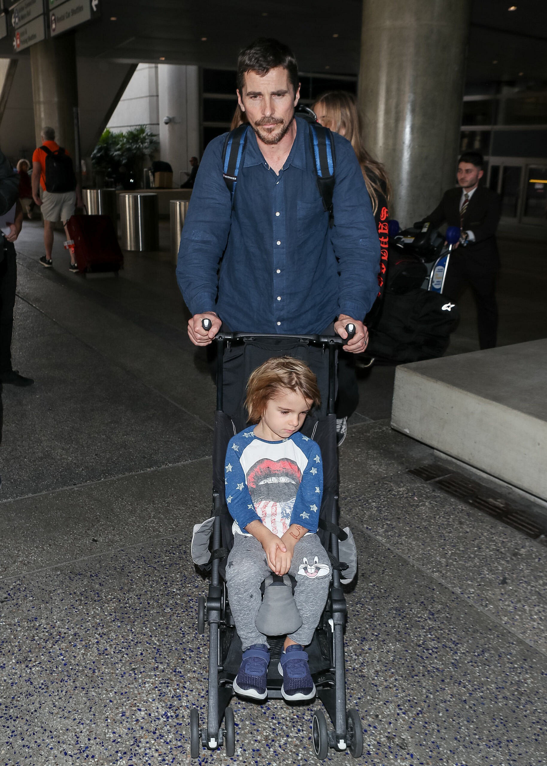 Christian Bale and his family at LAX International Airport