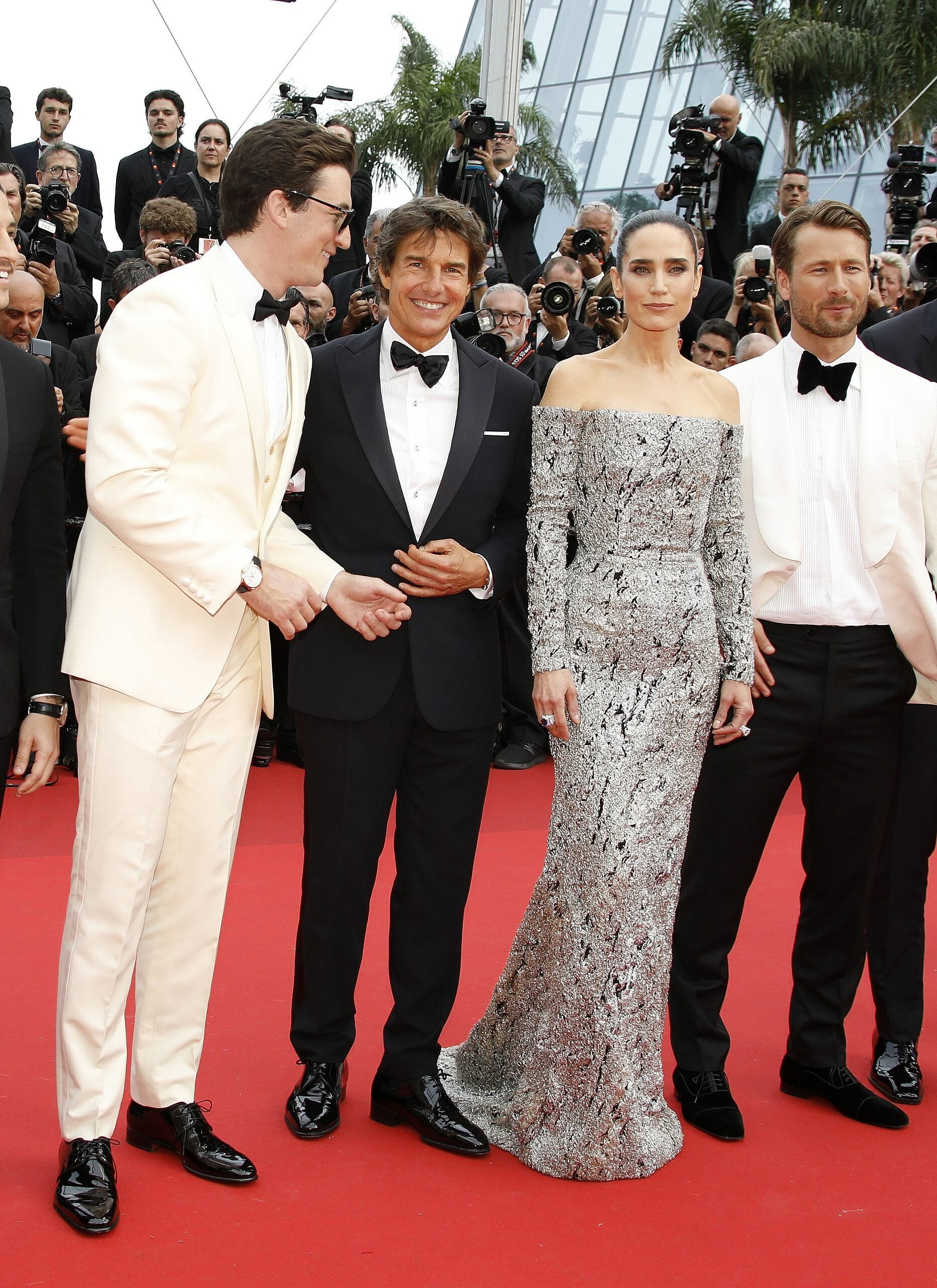 Miles Teller, Jennifer Connolly, Jerry Bruckheimer, Tom Cruise, The Duchess of Cambridge and Prince William attend the Top Gun Maverick Royal Film Performance, in Leicester Square, London. 19th May 2022. 20 May 2022 Pictured: Miles Teller, Tom Cruise, Jennifer Connolly and Jon Hamm attend the Top Gun Maverick Royal Film Performance, in Leicester Square, London. 19th May 2022. Photo: Andrew Sims The Sunday Times Material must be credited "The Times/News Licensing" unless otherwise agreed. 100% surcharge if not credited. Online rights need to be cleared separately. Strictly one time use only subject to agreement with News Licensing. Photo credit: News Licensing / MEGA TheMegaAgency.com +1 888 505 6342 (Mega Agency TagID: MEGA859850_087.jpg) [Photo via Mega Agency]
