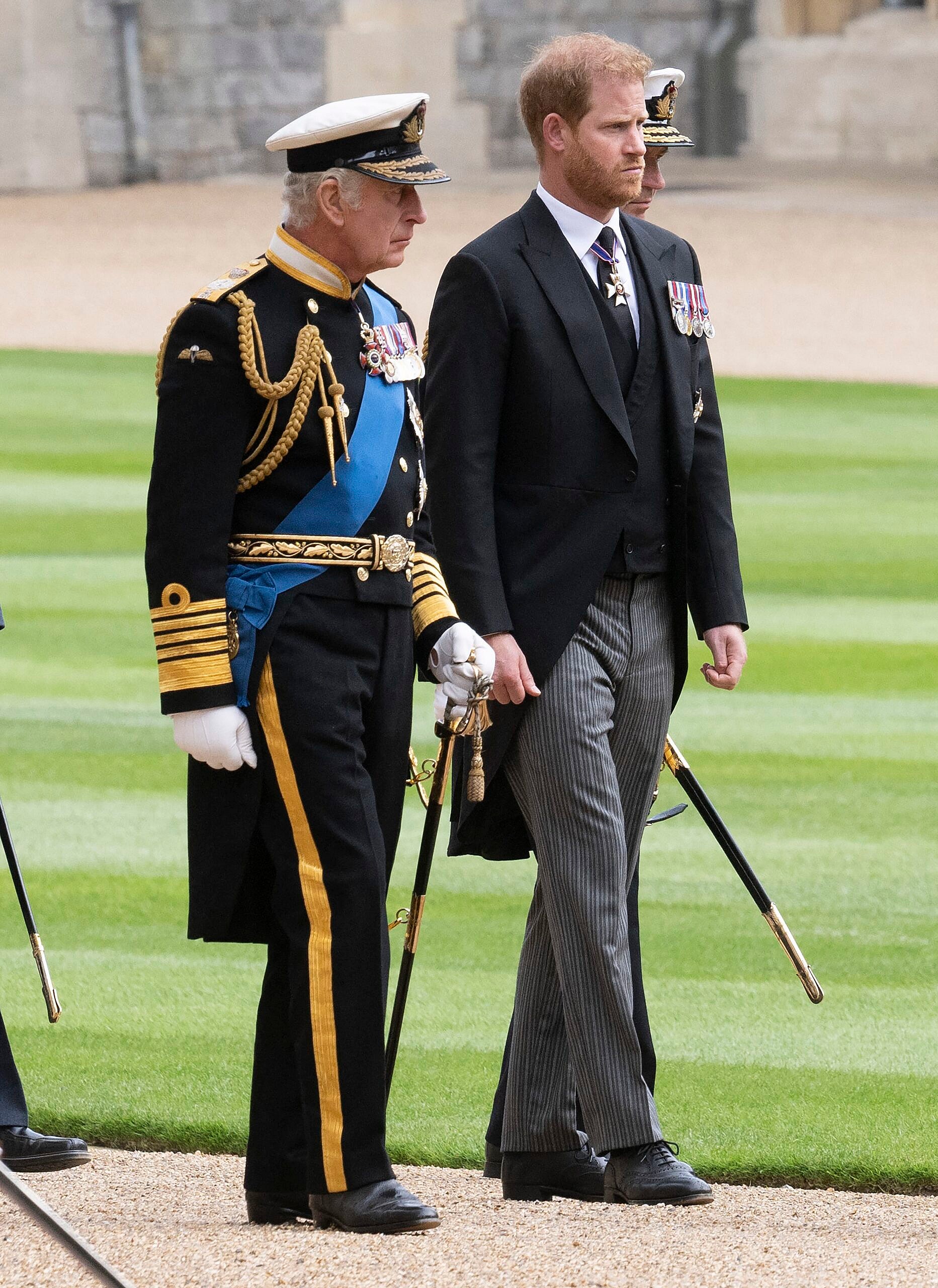 King Charles and Prince Harry at The Funeral procession of her Majesty, Queen Elizabeth II as it processes through Engine Court, Windsor Castle on its way to St Georges Chapel , her final resting place.