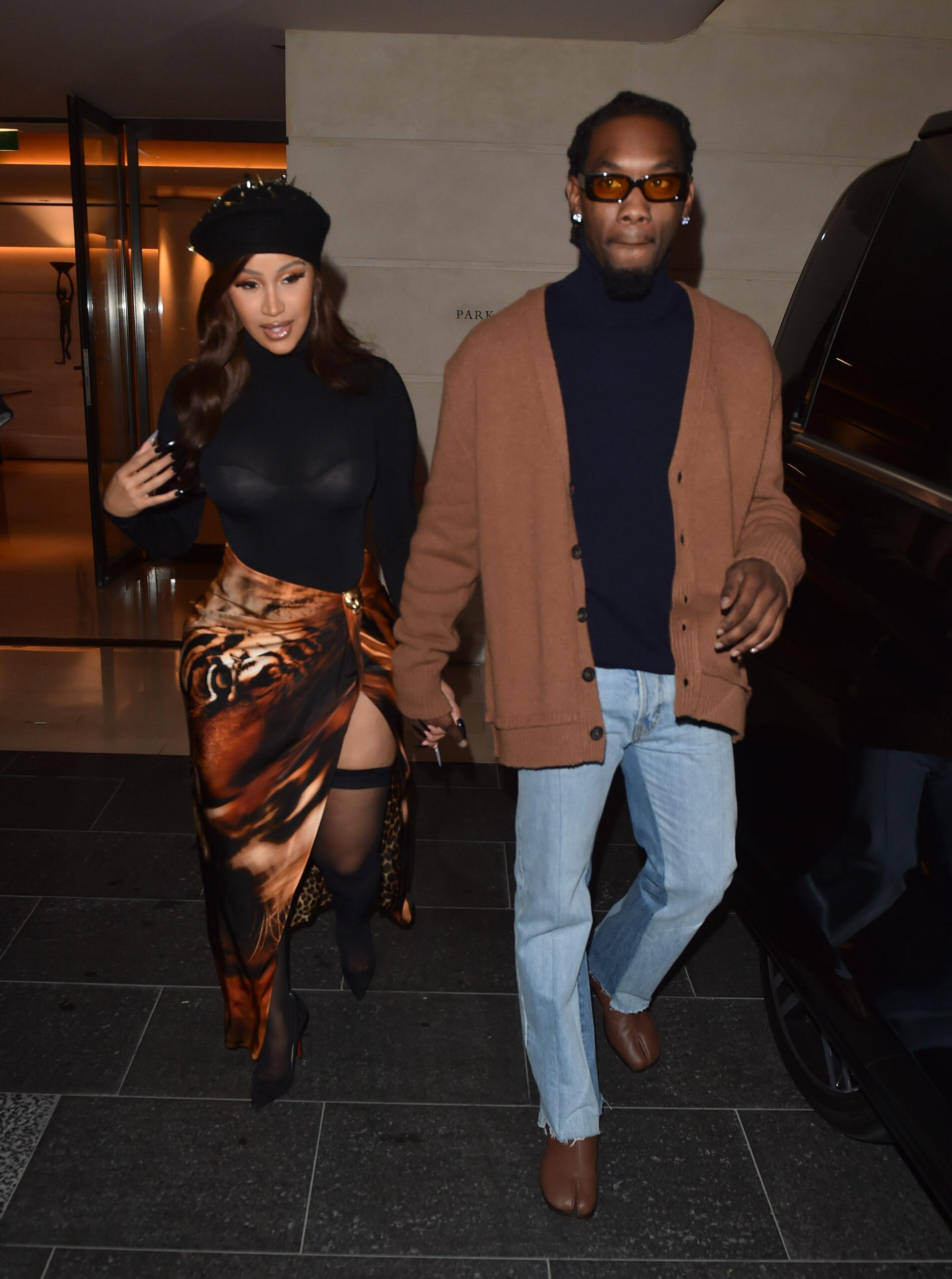 Cardi B shows some serious leg dressed in fishnets and a french beret with boyfriend Offset in Paris