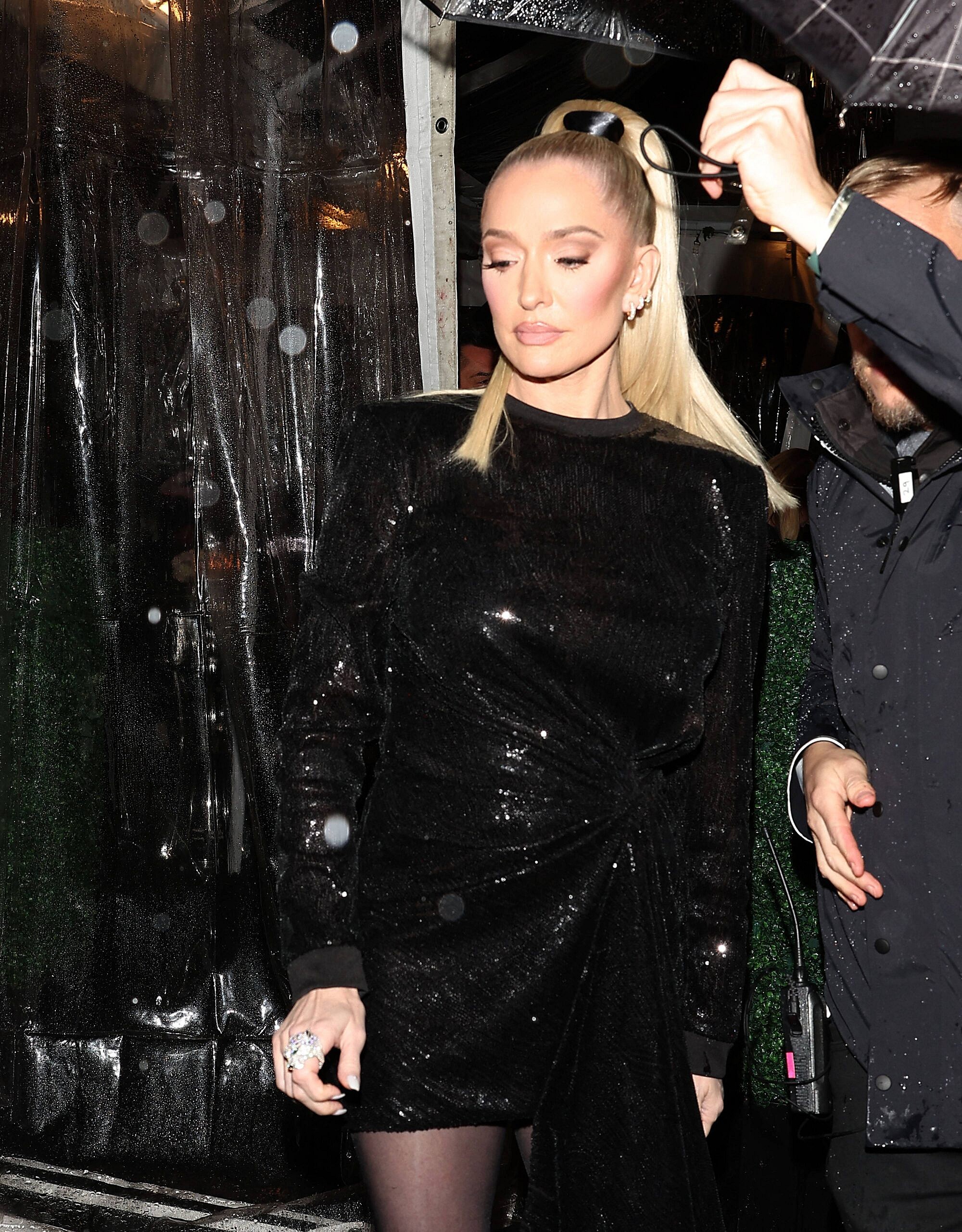 Erika Jayne was seen battling the rain while leaving Sutton Stracke apos s new Boutique called apos Suttol apos in West Hollywood CA