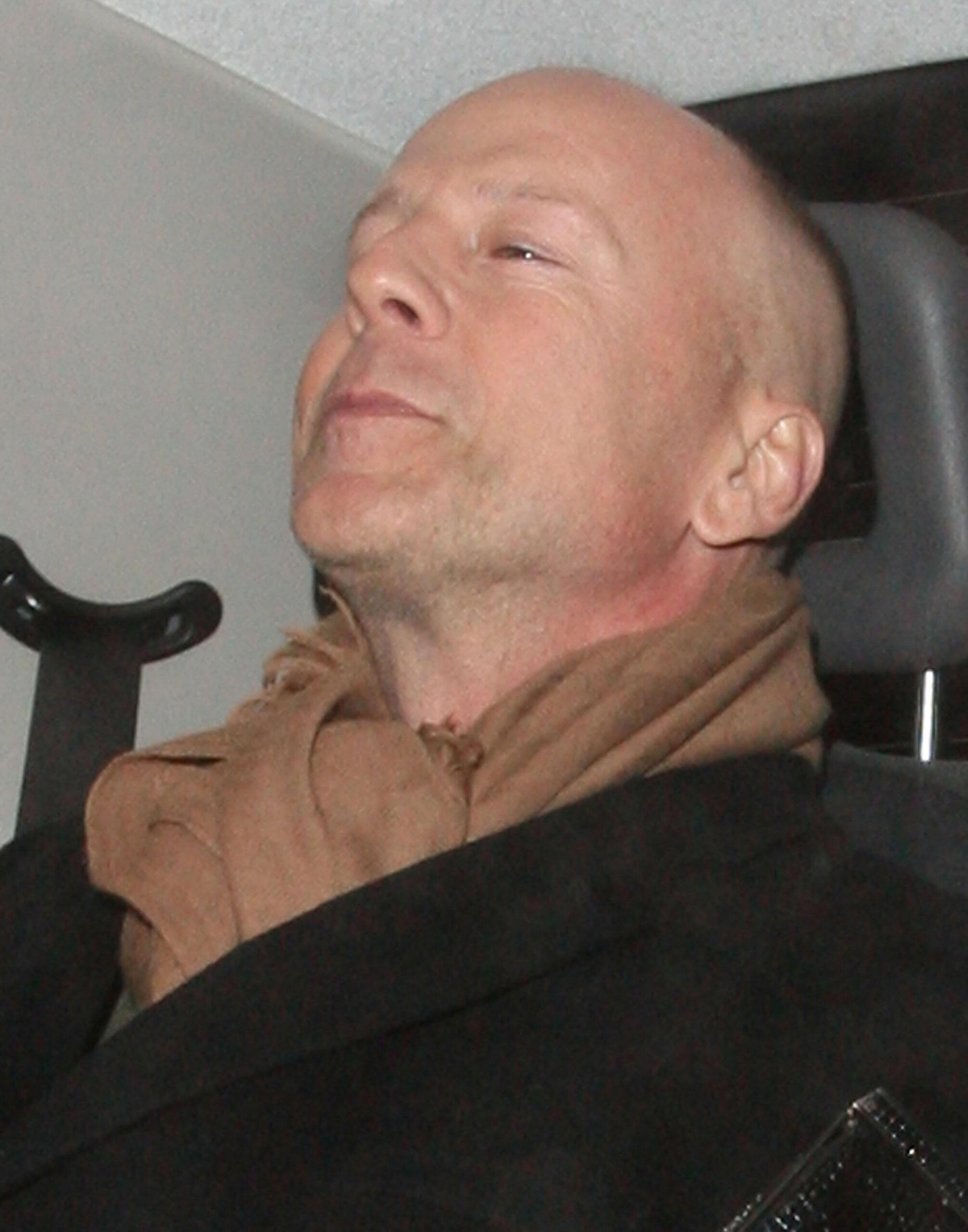 Bruce Willis and his new girlfriend Emma Heming arrive back at the Covent Garden Hotel in a black cab having had had dinner at The Ivy restaurant