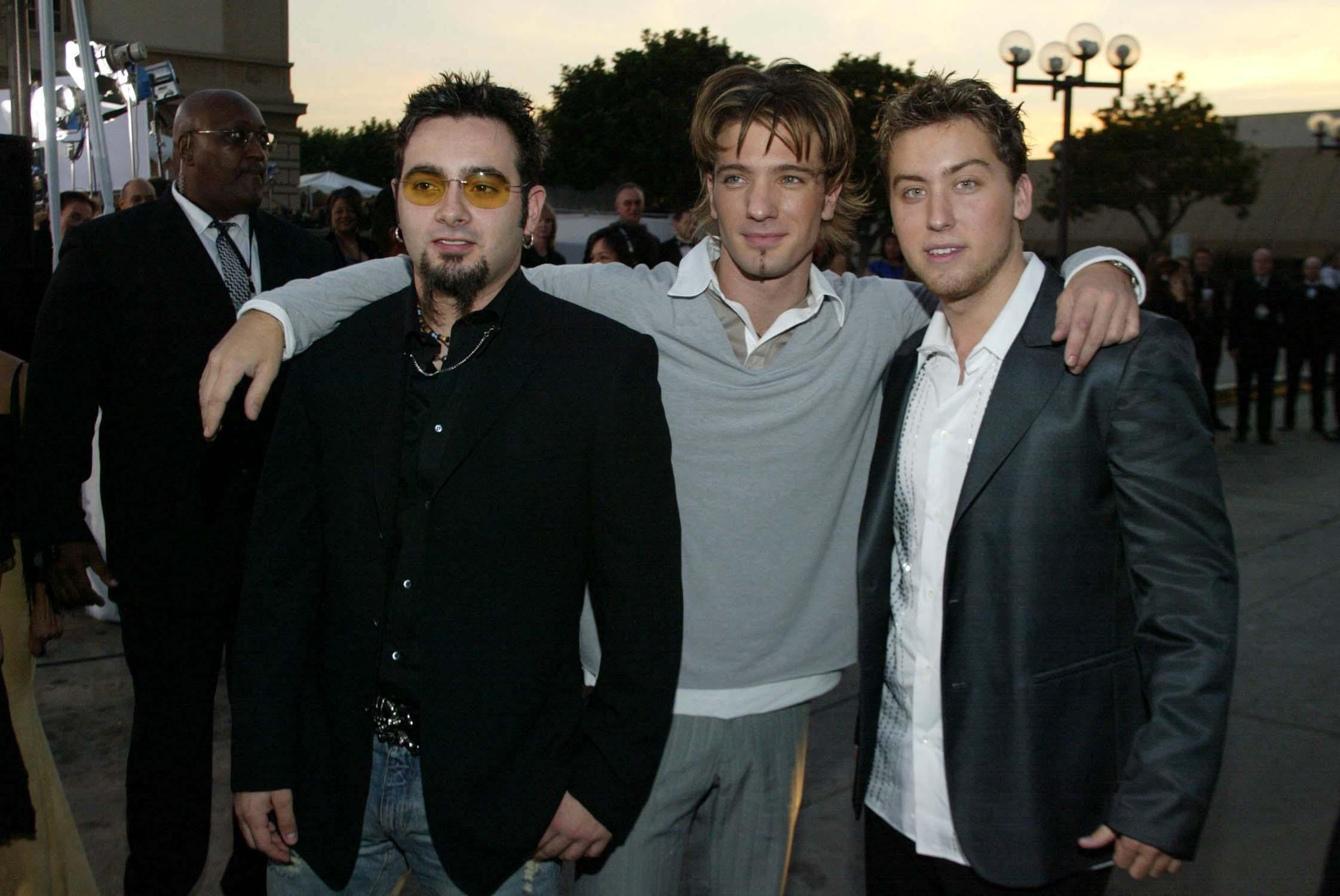 Lance Bass and members of NYSNC posing together. 