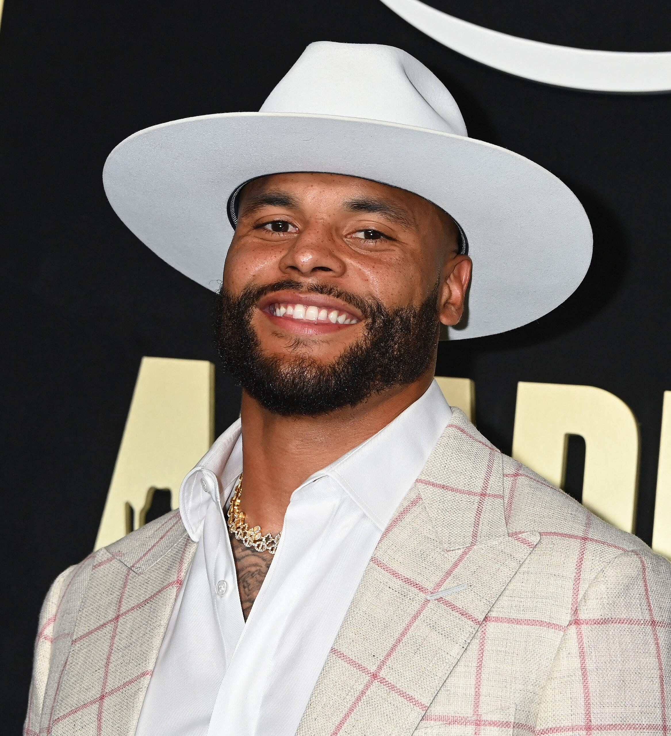 Dak Prescott posing on the red carpet. 