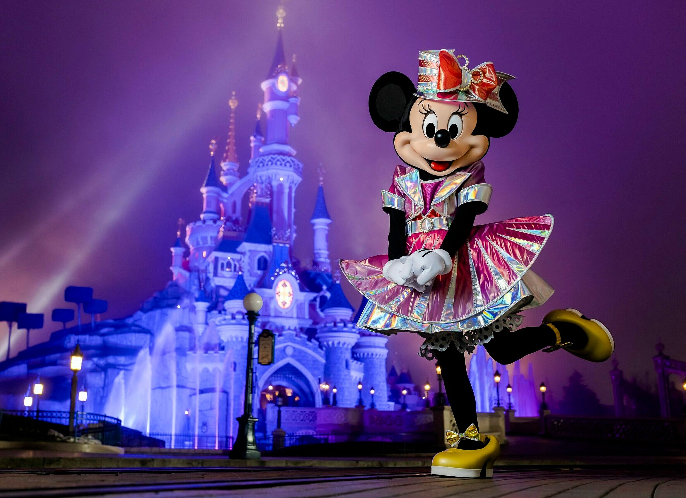 Minnie Mouse showcases a new pantsuit created by iconic fashion designer, Stella McCartney.