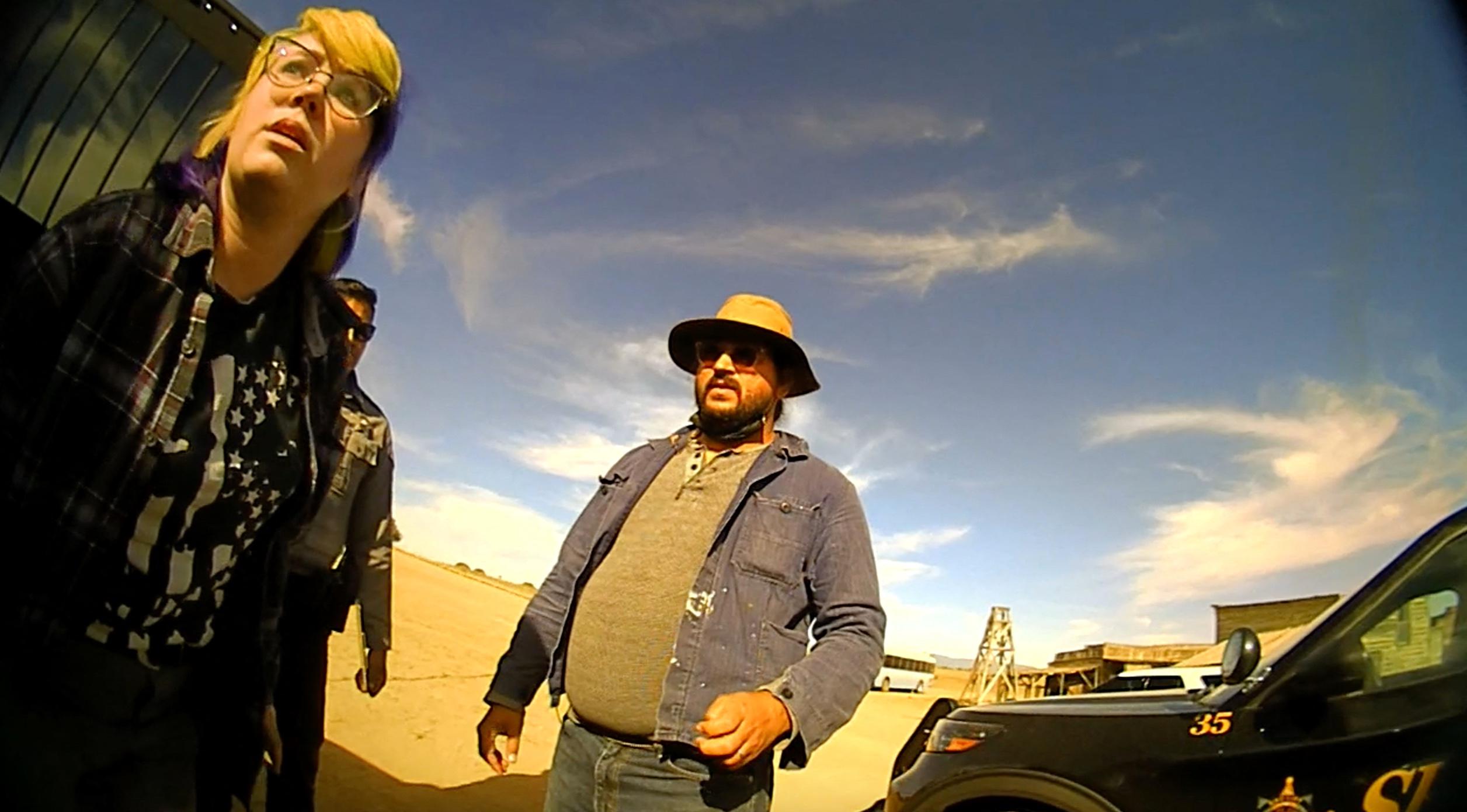 Hannah Gutierrez-Reed, the armourer on the set of Alec Baldwin movie Rust, where cinematographer Halyna Hutchins was shot dead, appears in police bodycam footage taken shortly after the fatal shooting in October 2021. She can be seen talking to police and can be heard telling an officer: “I just f****d up my whole entire career.” Bodycam footage captured on the New Mexico set shows Gutierrez-Reed sitting in the back of a police car before being escorted to a toilet by a female officer. The footage begins with Gutierrez-Reed answering a different officer’s questions. Gutierrez-Reed - who was in charge of weapons and ammunition on the set - first confirmed her place of work before responding to a question about her job title. When asked by a cop: “What’s your place of employment?” she responded, “Here”. The officer then asked: “What’s your job?” to which Gutierrez-Reed replied, “I’m the armourer, or at least I was.” Shortly afterwards, a female cop approaches the car Gutierrez-Reed is sitting in, saying: “Hi, you need to use the restroom?” Gutierrez-Reed confirms that she does, and the pair start walking across the film’s set towards the toilets. Gutierrez-Reed can be heard saying: “Welcome to the worst day of my life”, before adding: “I can’t believe Alec Baldwin was holding the gun, that’s so f****d.” Once in the bathroom, Gutierrez-Reed states: “I just want to get the f**k out of here and never show my face in this industry again. “I'm the only female armourer in the game and I just f****d up my whole entire career." She later refers to herself as a "f*****g failure." Files related to the ongoing investigation were released by Santa Fe County Sheriff's Office earlier this week. 27 Apr 2022 Pictured: Hannah Gutierrez-Reed, the armourer on the set of movie Rust, seen in police bodycam footage. Photo credit: Santa Fe County Sheriff/MEGA TheMegaAgency.com +1 888 505 6342 (Mega Agency TagID: MEGA851773_010.jpg) [Photo via Mega Agency]
