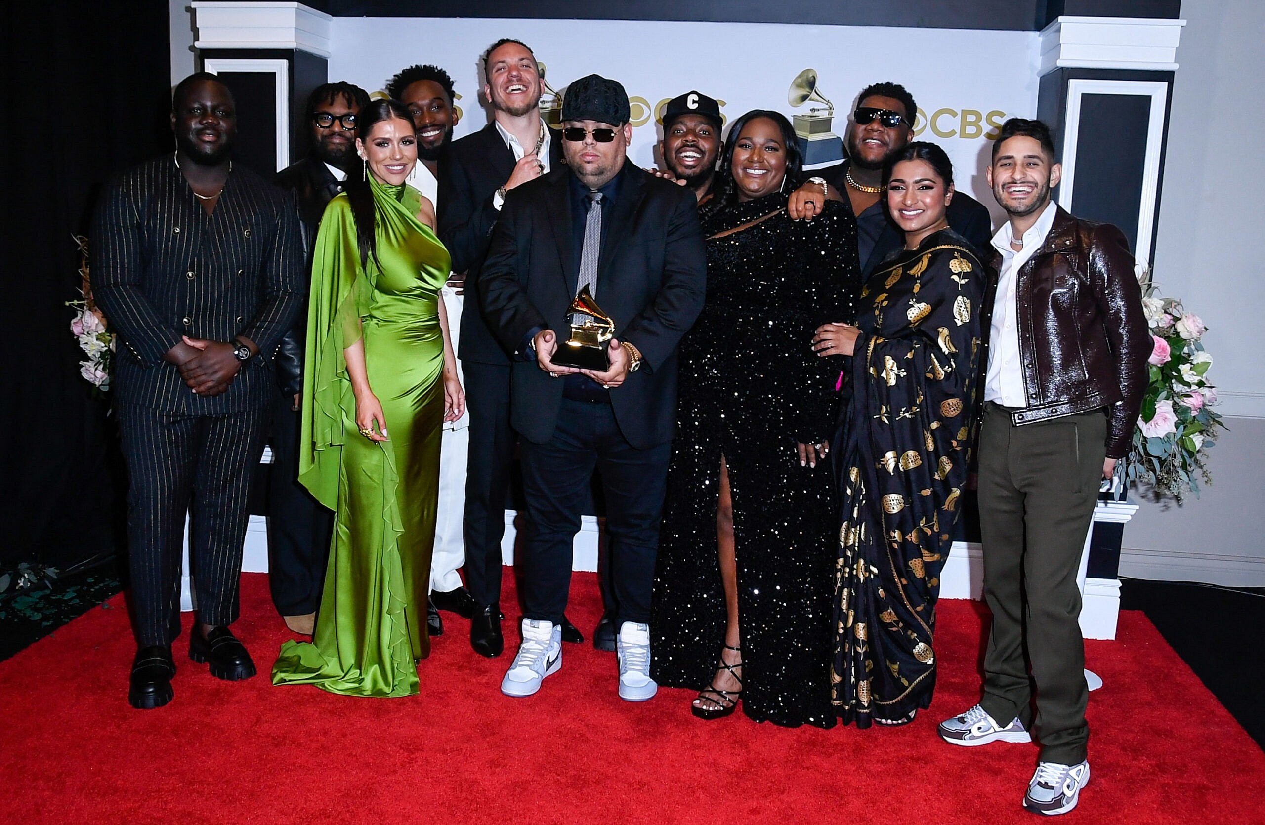 Maverick City Music posing on the red carpet.