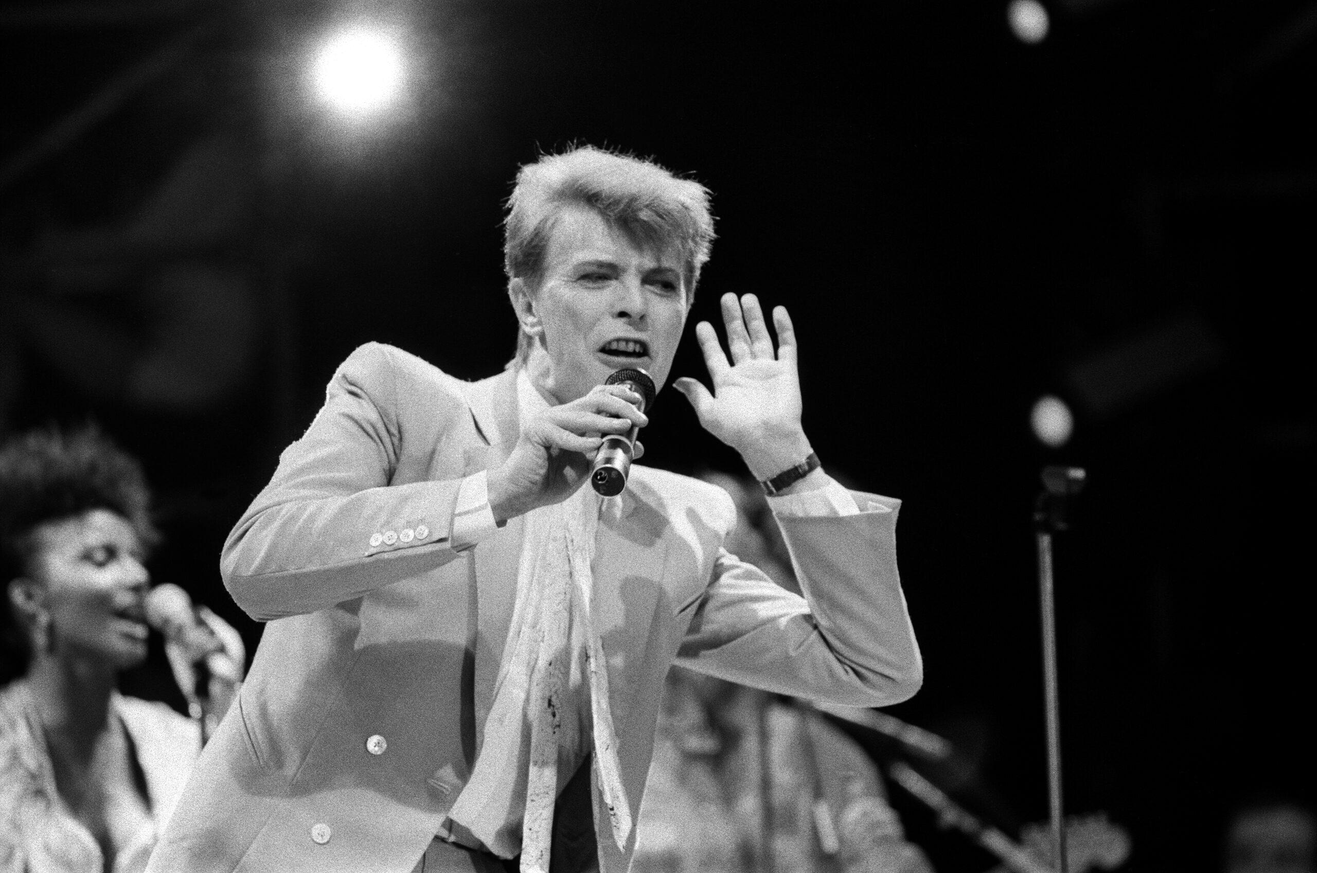 British pop singer David Bowie performing on stage during the Live Aid concert at Wembley Stadium. 13th July 1985.