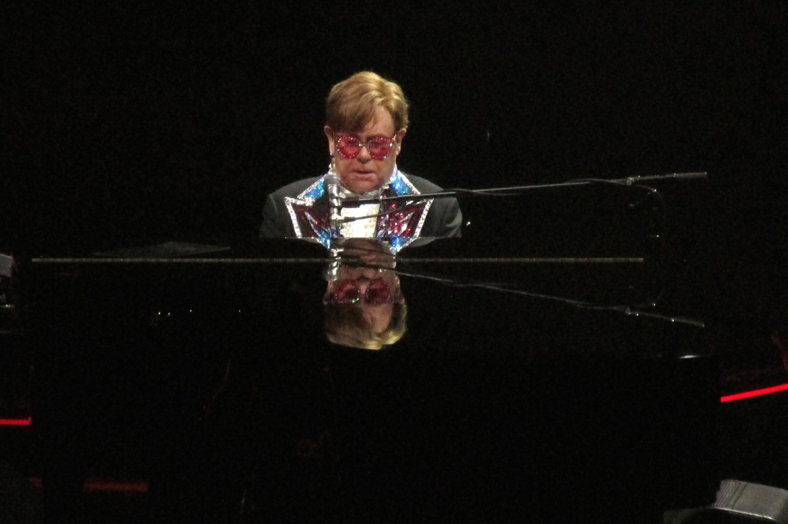 Elton John waves to the crowd as he changes three times during his finals shows in NYC